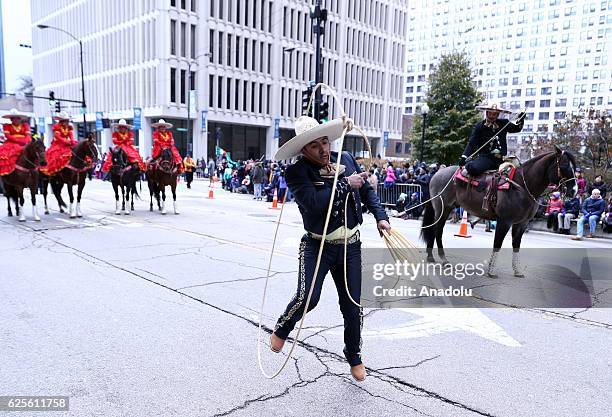 People attend the 83rd Annual Thanksgiving Day Parade at State Street in Chicago, Illinois on November 24, 2016. The parade featured marching bands...