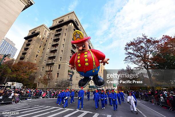 Amid heightened security Macy's department store staged its 90th annual Thanksgiving Day parade along Central Park West in a procession that included...