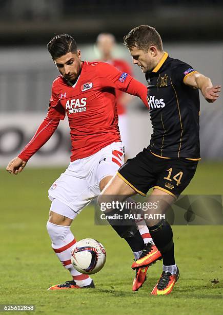 Alkmaar's Iranian striker Alireza Jahanbakhsh vies with Dundalk's Irish defender Dane Massey during the UEFA Europa League group D football match...