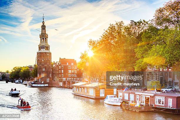 montelbaan tower at oude schans - amsterdam stock pictures, royalty-free photos & images