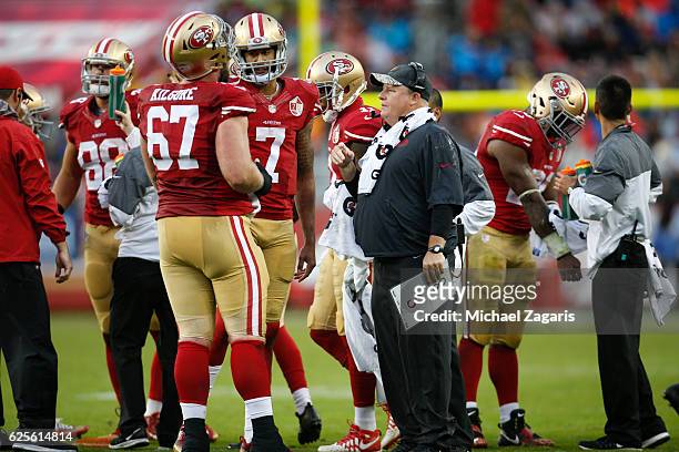 Head Coach Chip Kelly of the San Francisco 49ers huddles with the offense during the game against the New England Patriots at Levi Stadium on...