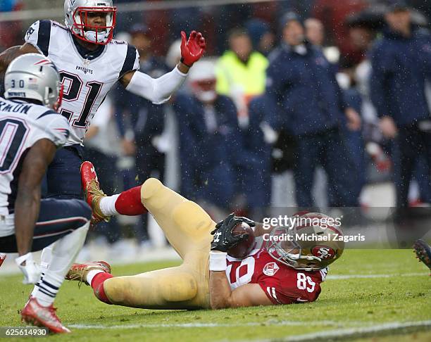 Vance McDonald of the San Francisco 49ers makes a reception during the game against the New England Patriots at Levi Stadium on November 11, 2016 in...
