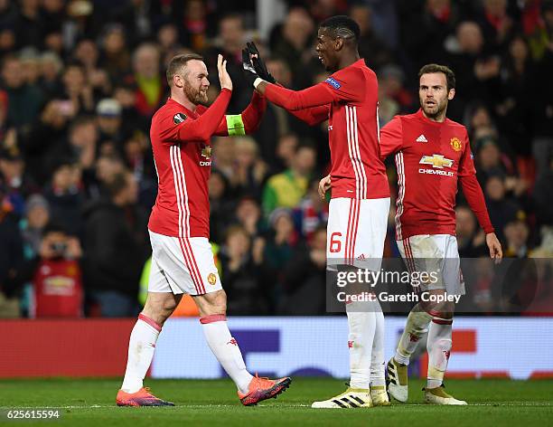Wayne Rooney of Manchester United celebrates with Paul Pogba as he scores their first goal during the UEFA Europa League Group A match between...