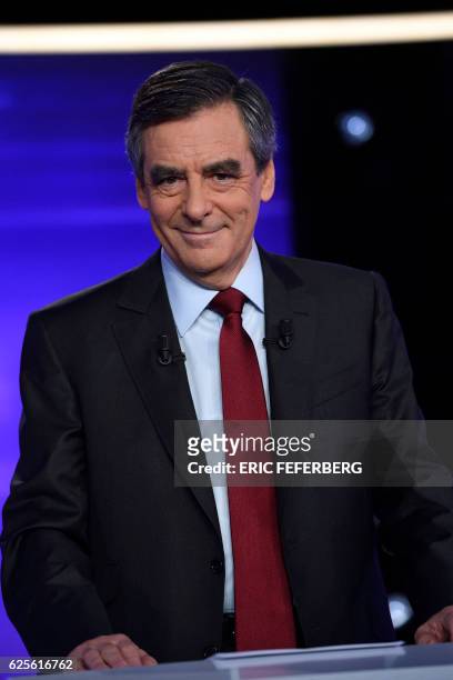 One of the two finalists in France's conservative presidential primary, Francois Fillon, smiles during the first televised debate between the two...