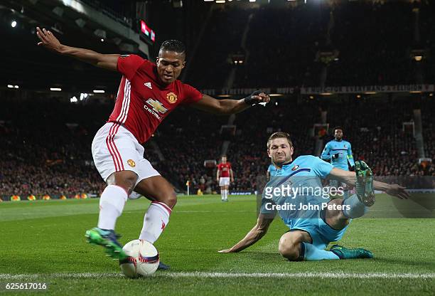 Antonio Valencia of Manchester United in action with Jan-Arie van der Heijden of Feyenoord during the UEFA Europa League match between Manchester...