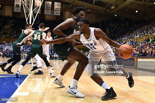 Amile Jefferson of the Duke Blue Devils drives against Nathan Knight of the William & Mary Tribe during their game at Cameron Indoor Stadium on...