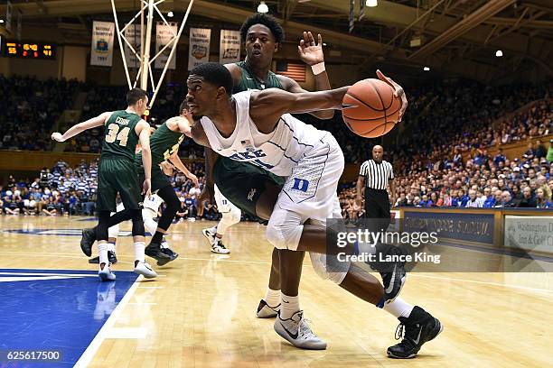 Amile Jefferson of the Duke Blue Devils drives against Nathan Knight of the William & Mary Tribe during their game at Cameron Indoor Stadium on...