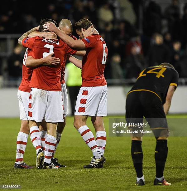 Dublin , Ireland - 24 November 2016; AZ Alkmaar players celebrate at the end of the game as a disapointed Dane Massey of Dundalk looks on at the UEFA...