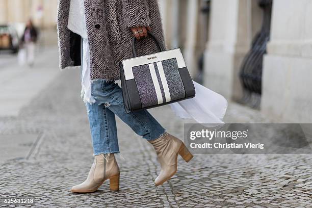 Jessi Quednau wearing light grey Buffalo boots, blue Levis denim jeans, grey poncho Zara, white blouse Zara, a grey teddy fluffy coat Lala Berlin, a...