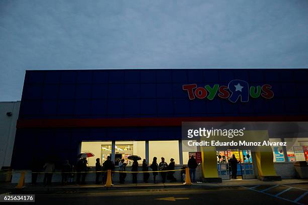 Shoppers wait in line outside of Toys"R"Us store during early Black Friday events on November 24, 2016 in Paramus, New Jersey. Although Black Friday...