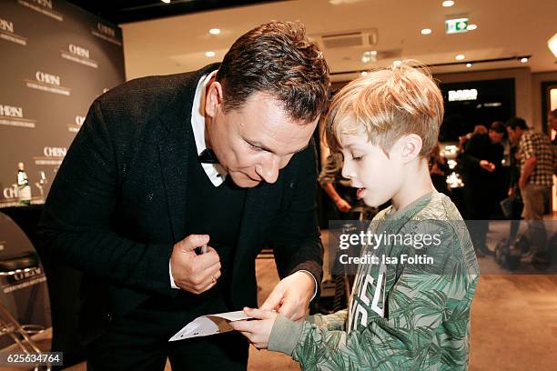 Designer Guido Maria Kretschmer with a fan at the 'Gluecksmuenz' collection launch by Guido Maria Kretschmer at CHRIST store on November 24, 2016 in...