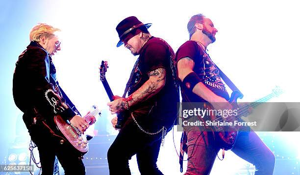 Chris Robertson, Ben Wells and Jon Lawhon of Black Stone Cherry perform at O2 Apollo Manchester on November 24, 2016 in Manchester, England.