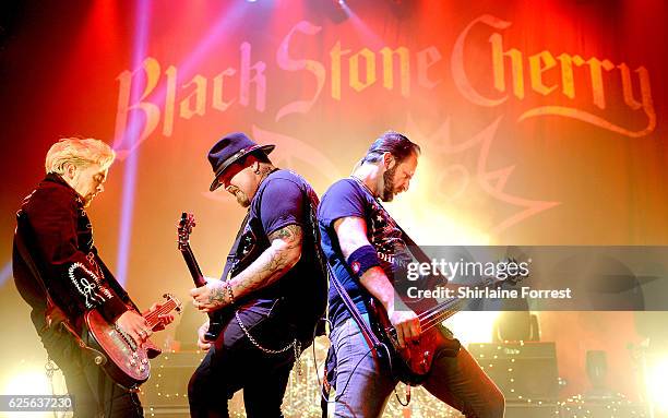 Chris Robertson, Ben Wells and Jon Lawhon of Black Stone Cherry perform at O2 Apollo Manchester on November 24, 2016 in Manchester, England.
