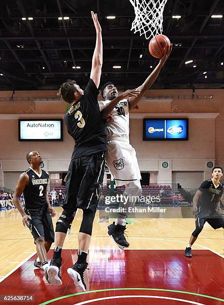 Kelan Martin of the Butler Bulldogs drives to the basket against Luke Kornet of the Vanderbilt Commodores during the 2016 Continental Tire Las Vegas...