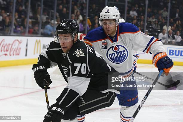 Los Angeles Kings Left Wing Tanner Pearson fights Edmonton Oilers Defenceman Adam Larsson for the puck on November 17 at the Staples Center in Los...