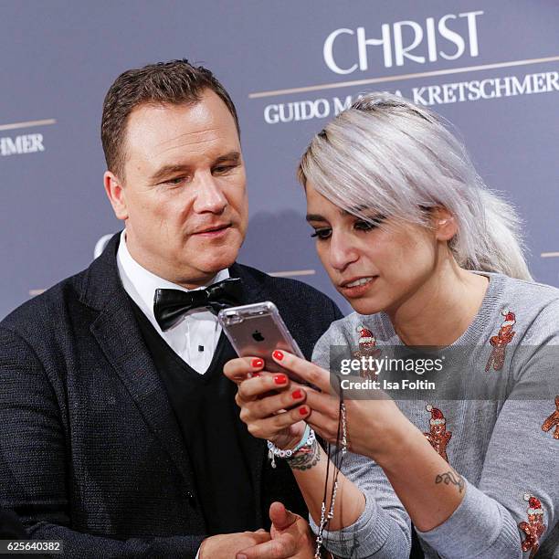 Designer Guido Maria Kretschmer and a editor of InStyle magazine Germany attend the 'Gluecksmuenz' collection launch by Guido Maria Kretschmer at...
