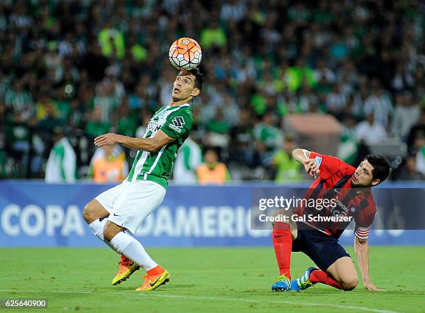 Diego Arias of Atletico Nacional struggles for the ball with Rodrigo Rojas of Cerro Porteño during a second leg match between Atletico Nacional and...