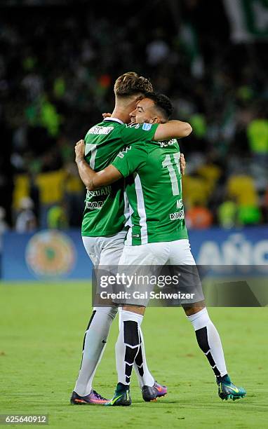 Ezequiel Rescaldani and Juan Pablo Nieto of Colombia's Atletico Nacional celebrate at the end of a second leg match between Atletico Nacional and...