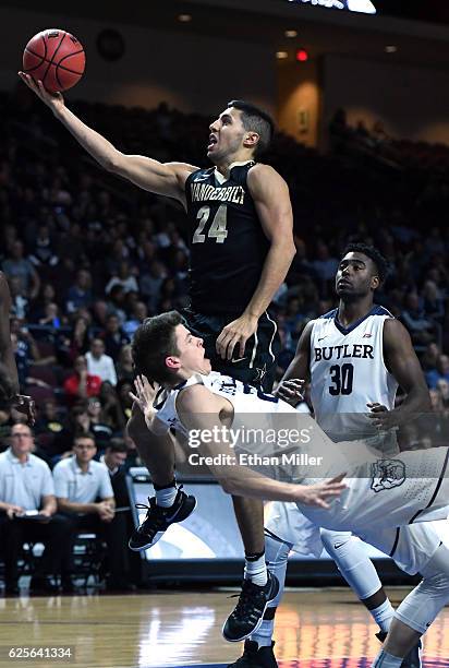 Sean McDermott of the Butler Bulldogs is called for a foul on Nolan Cressler of the Vanderbilt Commodores as he drives to the basket during the 2016...