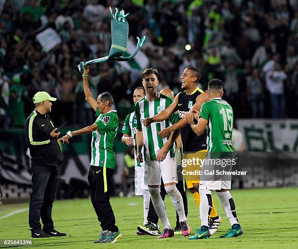 Players of Colombia's Atletico Nacional celebrate at the end of a second leg match between Atletico Nacional and Cerro Porteño as part of Semi Final...