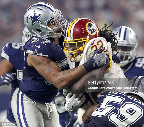 Dallas Cowboys linebacker Damien Wilson stuffs Washington Redskins running back Robert Kelley during the second half on Thursday, Nov. 24, 2016 at...