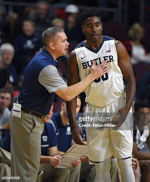 Head coach Chris Holtmann of the Butler Bulldogs talks to Kelan Martin as they take on the Vanderbilt Commodores during the 2016 Continental Tire Las...