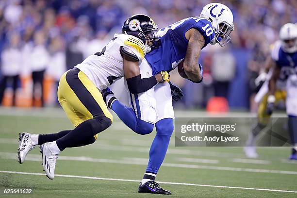 Donte Moncrief of the Indianapolis Colts is tackled by Artie Burns of the Pittsburgh Steelers during the second half of the game at Lucas Oil Stadium...