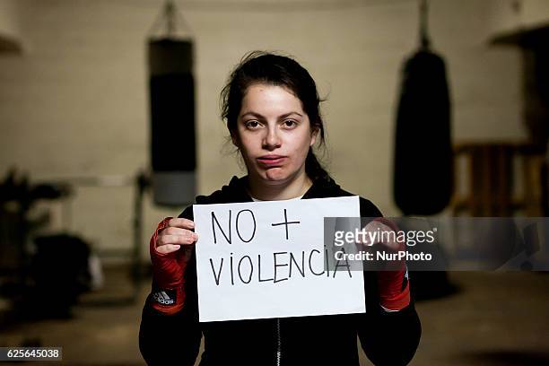 Sofía Jimenez fifteen years old amateur boxer from the School of Carlos &quot;Látigo&quot; Uribe, holds in her hands a sign saying &quot;No to...