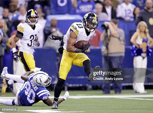 Mike Mitchell of the Pittsburgh Steelers avoids a tackle from Chester Rogers of the Indianapolis Colts during an interception return in the fourth...