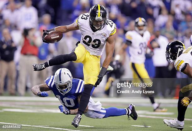 Mike Mitchell of the Pittsburgh Steelers hurdles Donte Moncrief of the Indianapolis Colts as he returns an interception during the fourth quarter of...