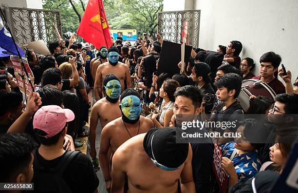 Nude members of a university fraternity participate in a "Oblation Run" to protest against the burial of the late dictator Ferdinand Marcos at the...