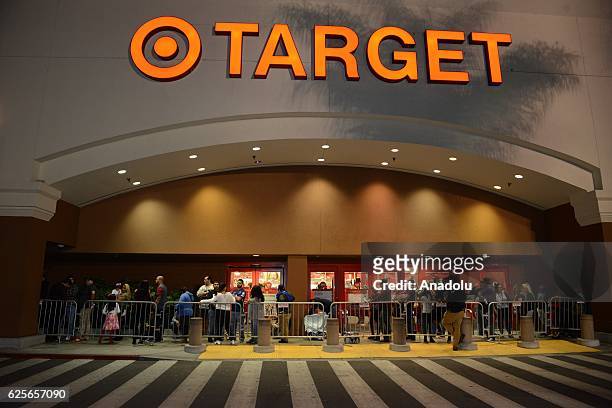 Shoppers are seen outside the "Target" shopping mall during the sales on a day before "Black Friday" in Los Angeles, USA on November 24, 2016. The...
