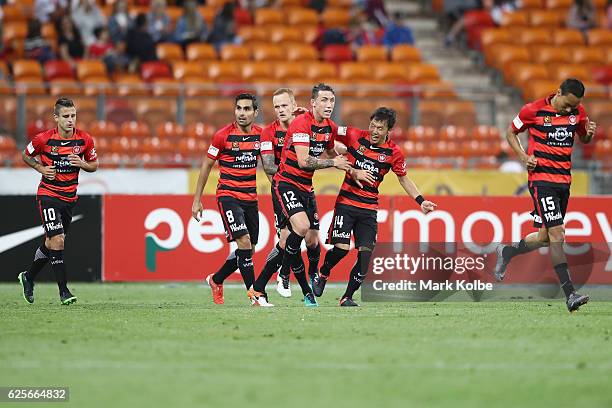 Jumpei Kusukami of the Wanderers celebrates with his team mates after scoring a goal during the round eight A-League match between the Western Sydney...