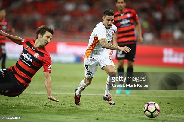 Jamie Maclaren of the Roar takes the ball past Artiz borda of the Wanderers during the round eight A-League match between the Western Sydney...