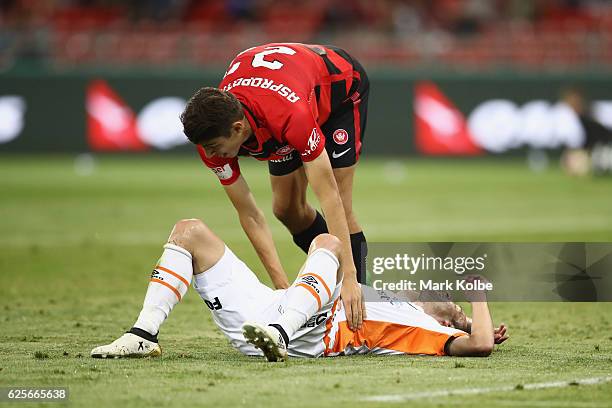 Jonathan Aspropotamitis of the Wanderers stands over the fallen Arana of the Roar during the round eight A-League match between the Western Sydney...