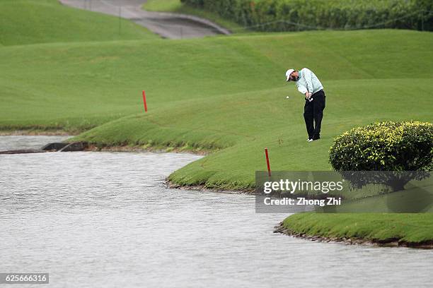 Paul Imondi of the United States plays a shot during the second round of the Buick open at Guangzhou Foison Golf Club on November 25, 2016 in...