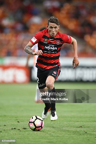 Scott Neville of the Wanderers runs with the ball during the round eight A-League match between the Western Sydney Wanderers and the Brisbane Roar at...