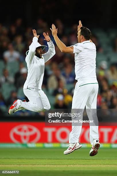 Kyle Abbott of South Africa celebrates with team mate Temba Bavuma after dismissing Peter Handscomb of Australia during day two of the Third Test...