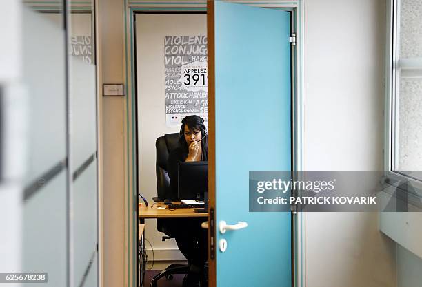 An employee of the French Fédération Nationale Solidarité Femmes receives calls of the French national domestic and sexual violence against women...