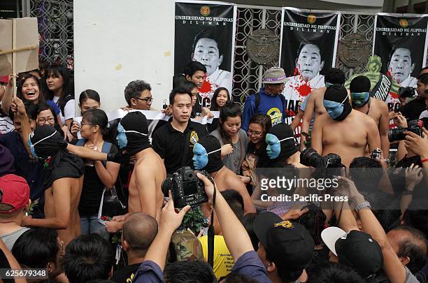 Nude members of the Alpha Phi Omega fraternity walk through the crowd during the annual Oblation Run at the University of the Philippines. This...