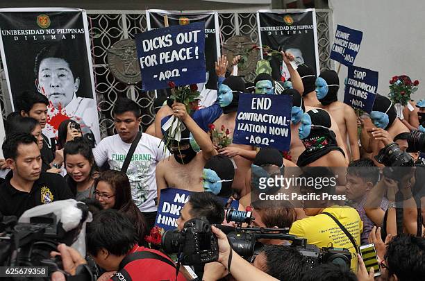 Nude members of the Alpha Phi Omega fraternity walk through the crowd during the annual Oblation Run at the University of the Philippines. This...