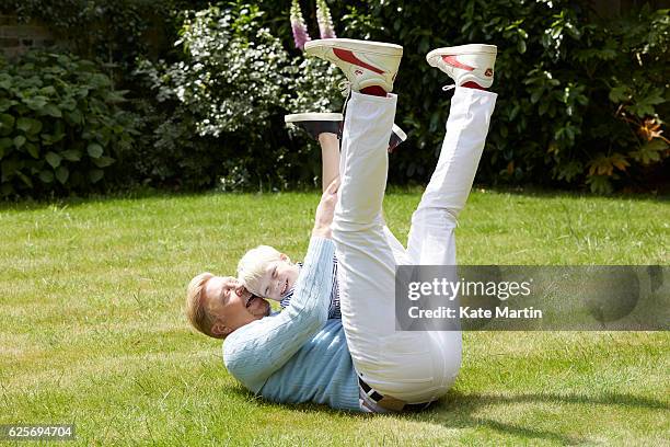 Tv commentator and former champion player Boris Becker with his son Amadeus are photographed at home for Hello magazine on June 15, 2015 in London,...