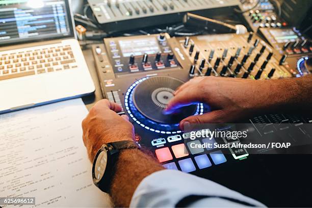 dj player scratching records on turntable - record scratching stock pictures, royalty-free photos & images