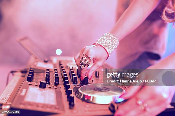 close-up of female dj working on turntable - record scratching stock pictures, royalty-free photos & images