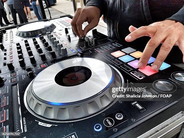 close-up of dj spinning records on turntable - record scratching stock pictures, royalty-free photos & images