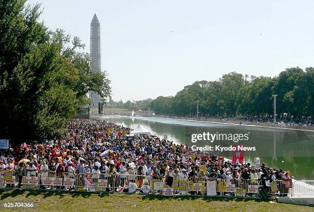 United States - People gather at the National Mall in Washington, D.C. On Aug. 24 to attend an event commemorating the 50th anniversary of the 1963...