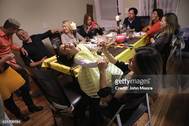 Immigrants from Central America and Mexico celebrate Thanksgiving on November 24, 2016 in Stamford, Connecticut. Family and friends, some of them...
