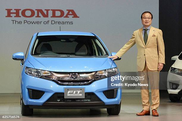 Japan - Takanobu Ito, president of Honda Motor Co., unveils a fully-renovated version of the Fit hybrid in Urayasu, Chiba Prefecture on Sept. 5,...