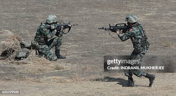 Soldiers from the Indian Army and People's Liberation Army take part in an anti-terror drill during the Sixth India-China Joint Training exercise...