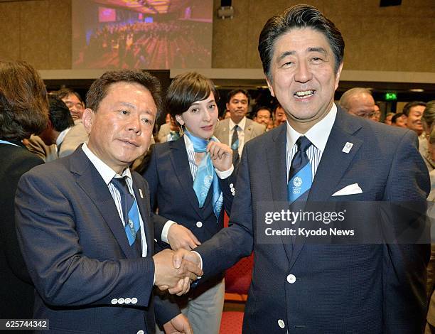 Argentina - Japanese Prime Minister Shinzo Abe and Tokyo Gov. Naoki Inose shake hands after Tokyo was chosen as the city to host the 2020 Summer...